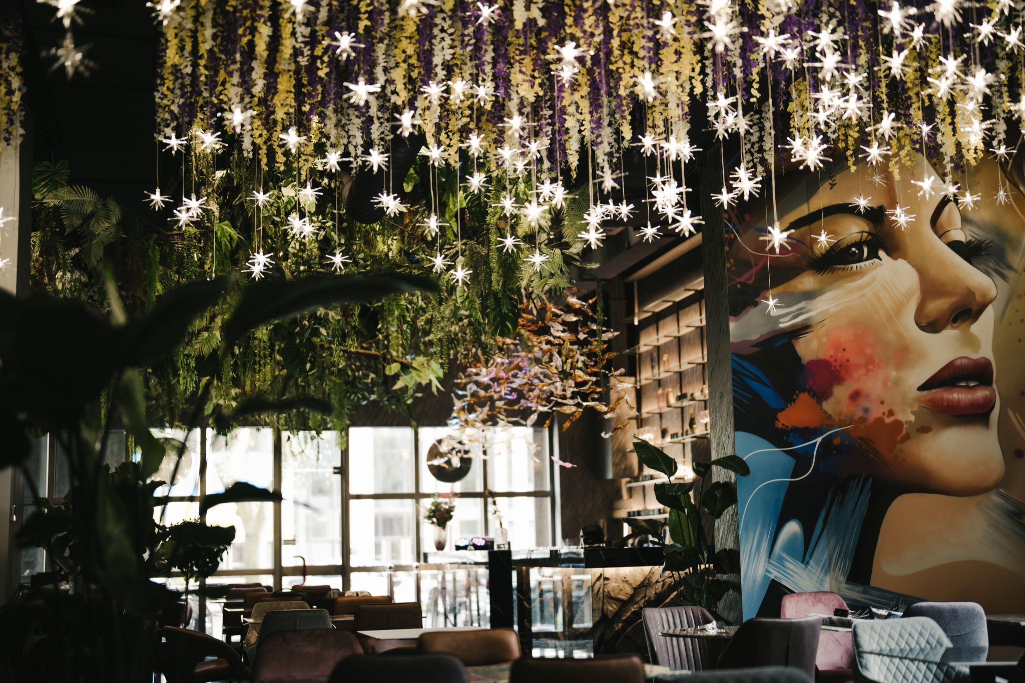 interior of the restaurant with flowers and starlights on the ceiling